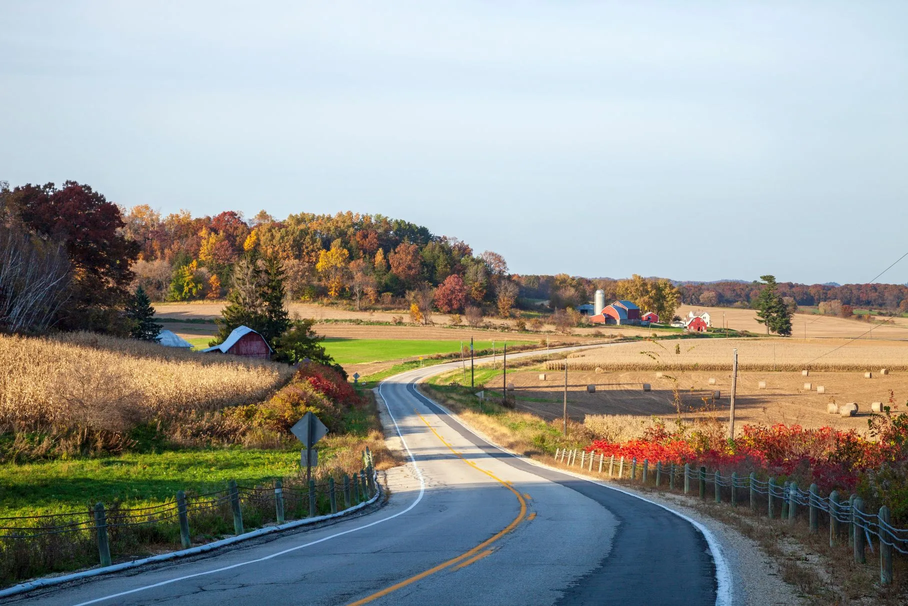curving road and farms in wisconsin